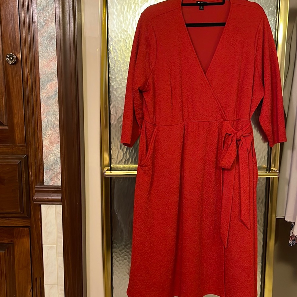 Torrid burnt orange wrap style dress. 3/4 sleeve